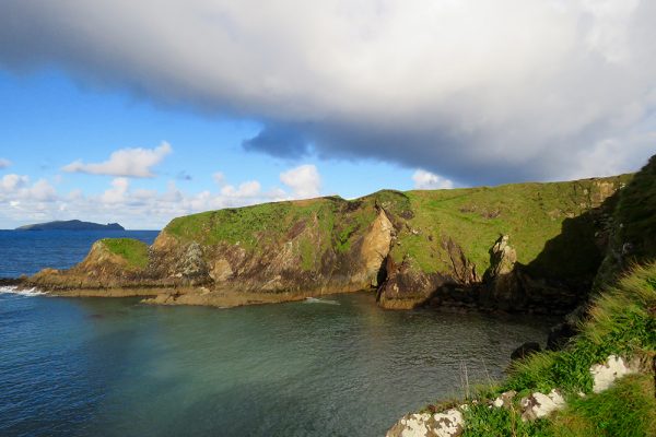The cliffs of Dunquin with a view of An Fear Marbh on the Wild Atlantic Way walk